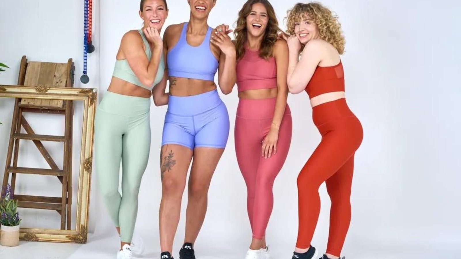 Four Women in Photo Studio Wearing Gym Clothes 